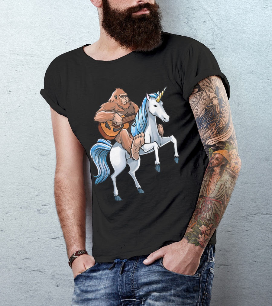 Bigfoot Playing Guitar Riding A Unicorn T-Shirt