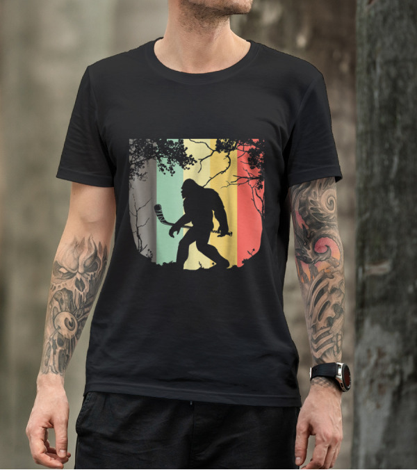 Vintage Bigfoot Hockey Silhouette With Retro Stripes In Forest Setting T-Shirt