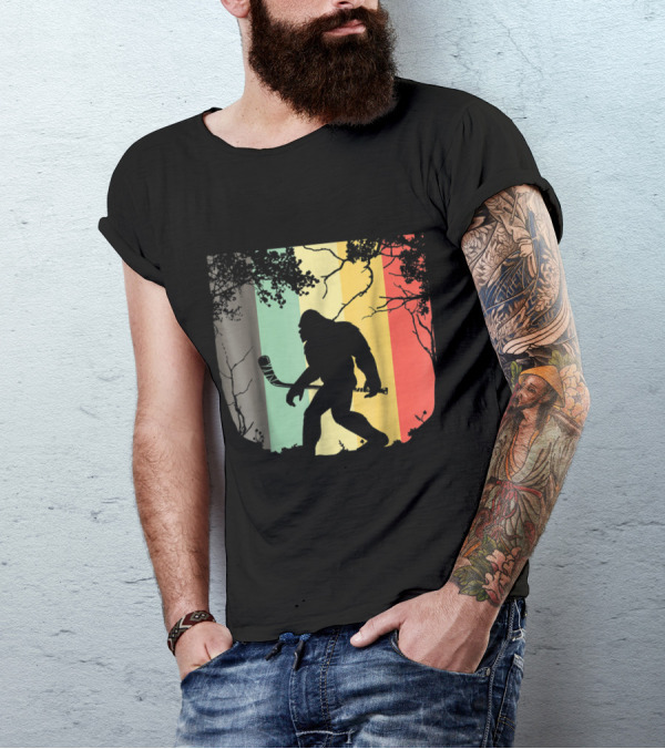 Vintage Bigfoot Hockey Silhouette With Retro Stripes In Forest Setting T-Shirt