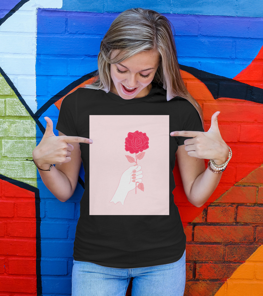 Feminist Rose Hand Holding Red Flower On Pink Background T-Shirt