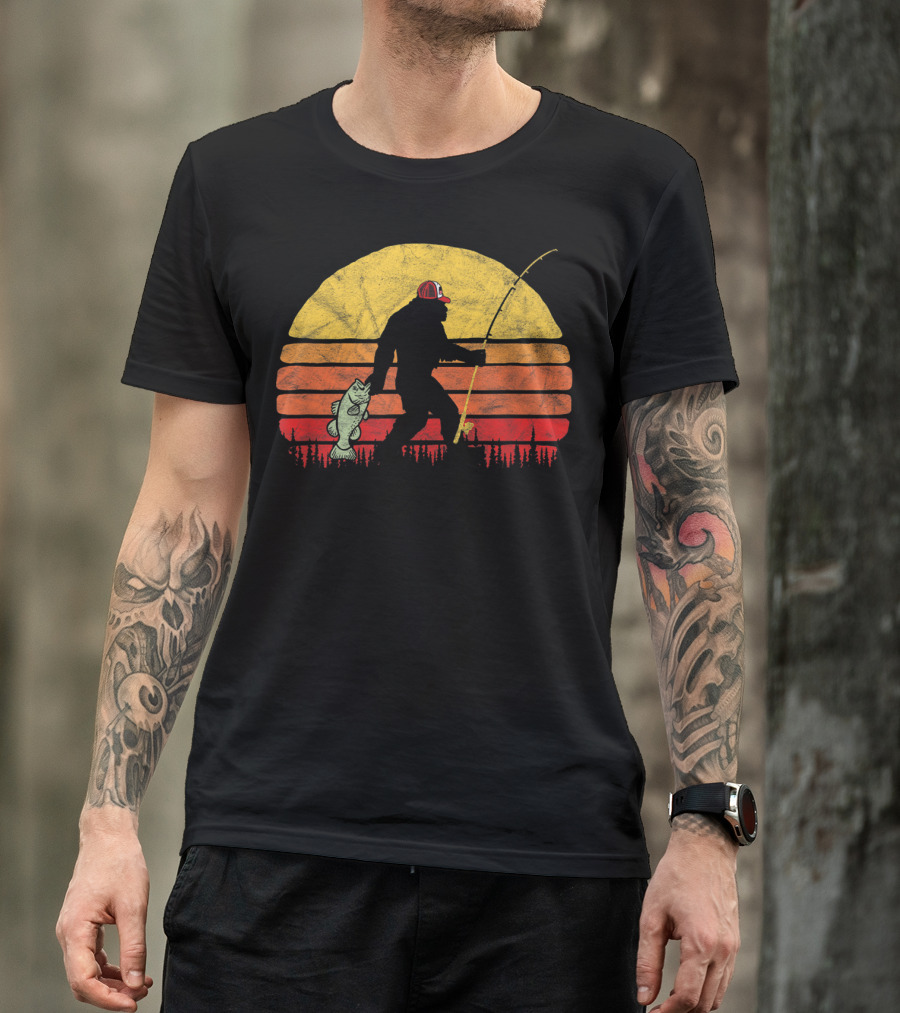 Bass Fishing Bigfoot Silhouette In Trucker Hat With Sunset Background T-Shirt