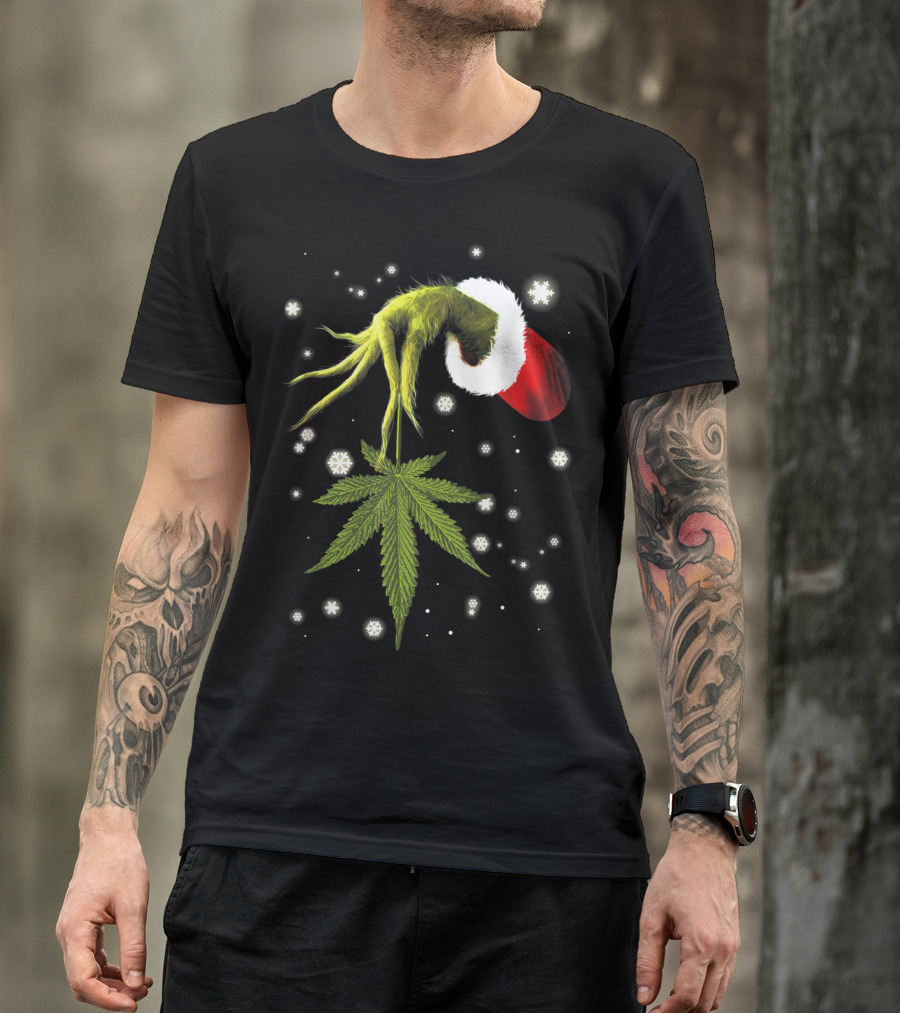 Grinch Hand Holding Cannabis Leaf With Santa Hat And Snowflakes T-Shirt