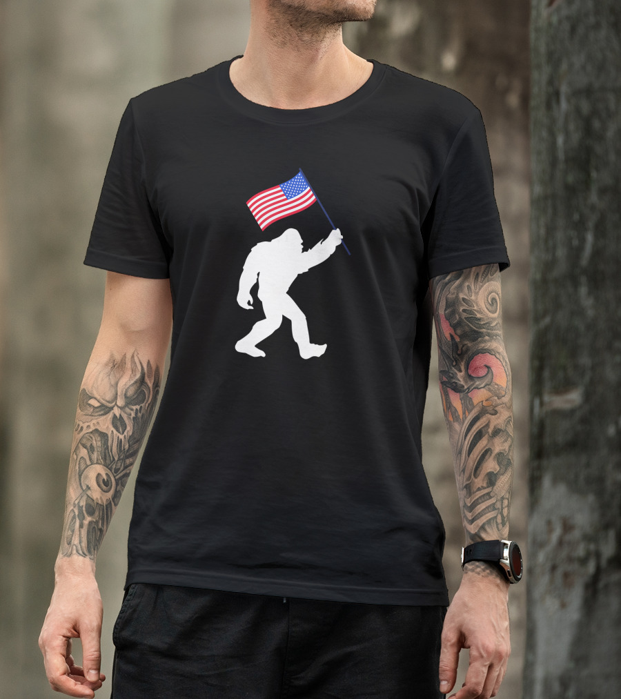 Funny Bigfoot Carrying American Flag For 4th Of July Celebrations T-Shirt