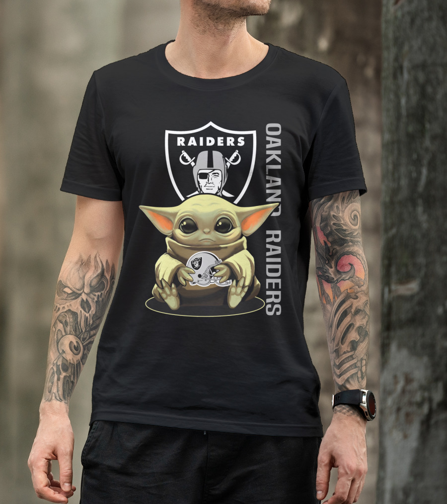 Baby Yoda Holding Oakland Raiders Helmet With Raiders Logo In Background T-Shirt