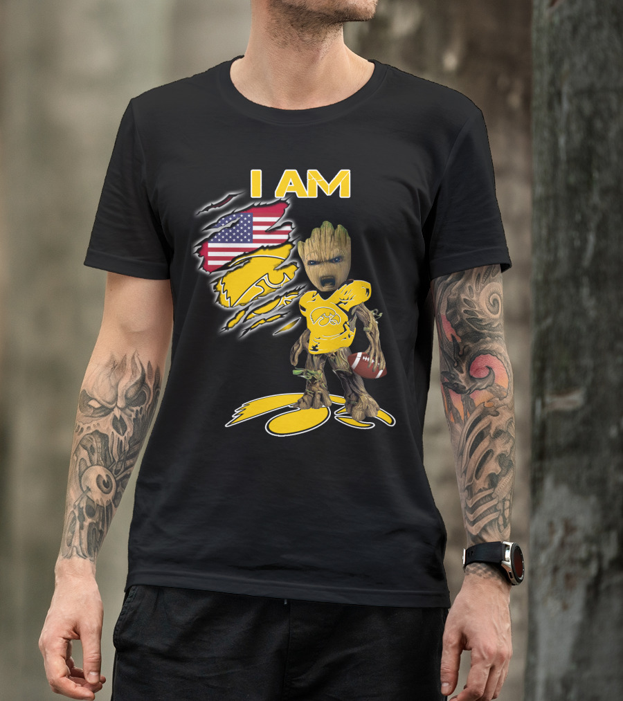 I Am Hawkeyes Baby Groot Holding Football With Usa Flag And Iowa Hawkeyes T-Shirt