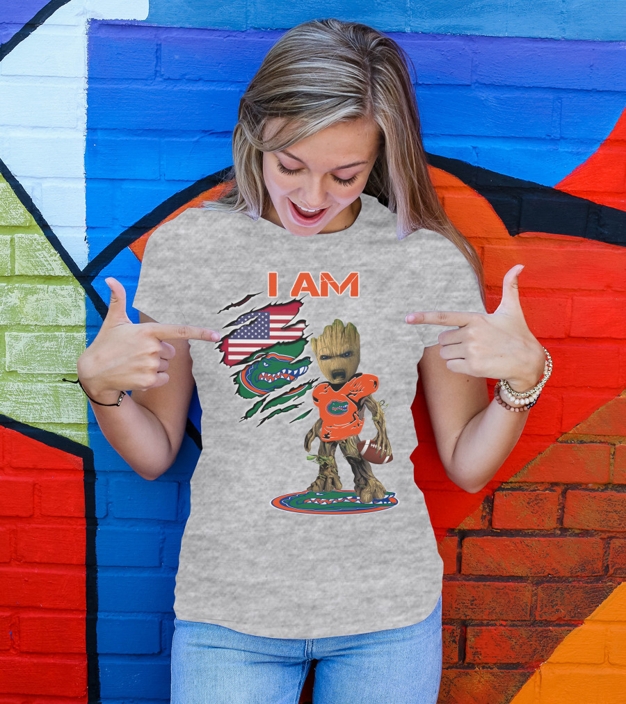 I Am Gators Baby Groot Holding Football With American Flag And Florida Gators T-Shirt