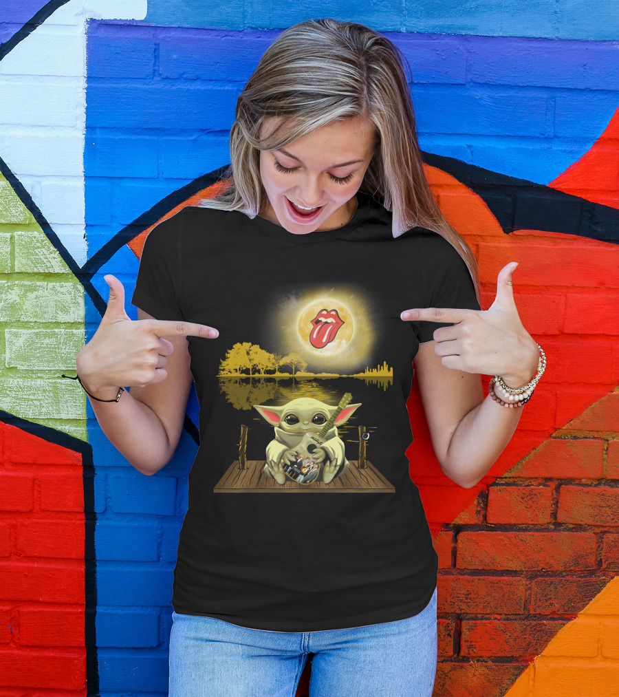 The Rolling Stones Tongue Logo And Baby Yoda With Guitar Under Moonlit Sky Trees And Lake Reflection T-Shirt