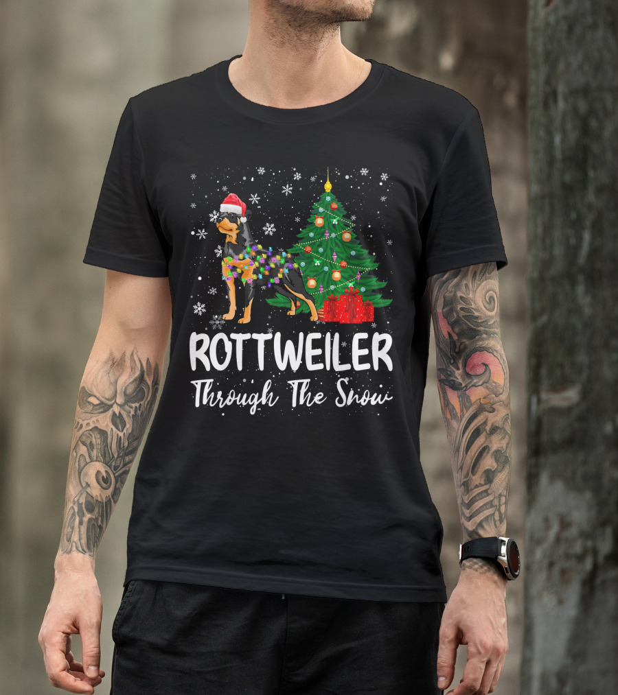 Rottweiler Through The Snow Santa Hat Christmas Tree Snowflakes T-Shirt