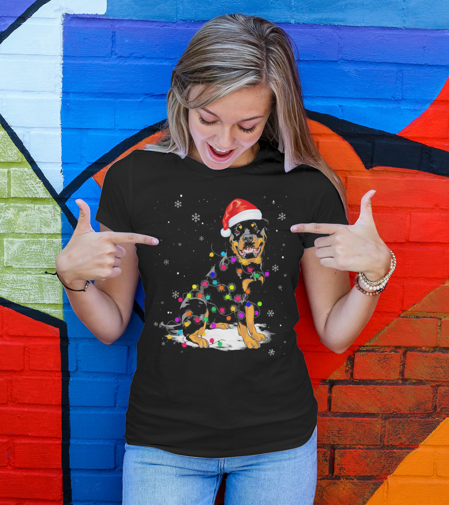 Rottweiler Wearing Santa Hat Wrapped In Colorful Christmas Lights With Snowflakes T-Shirt