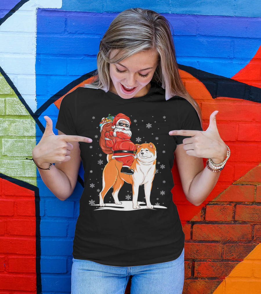 Santa Claus Riding Akita With Snowflakes And Gift Sack T-Shirt