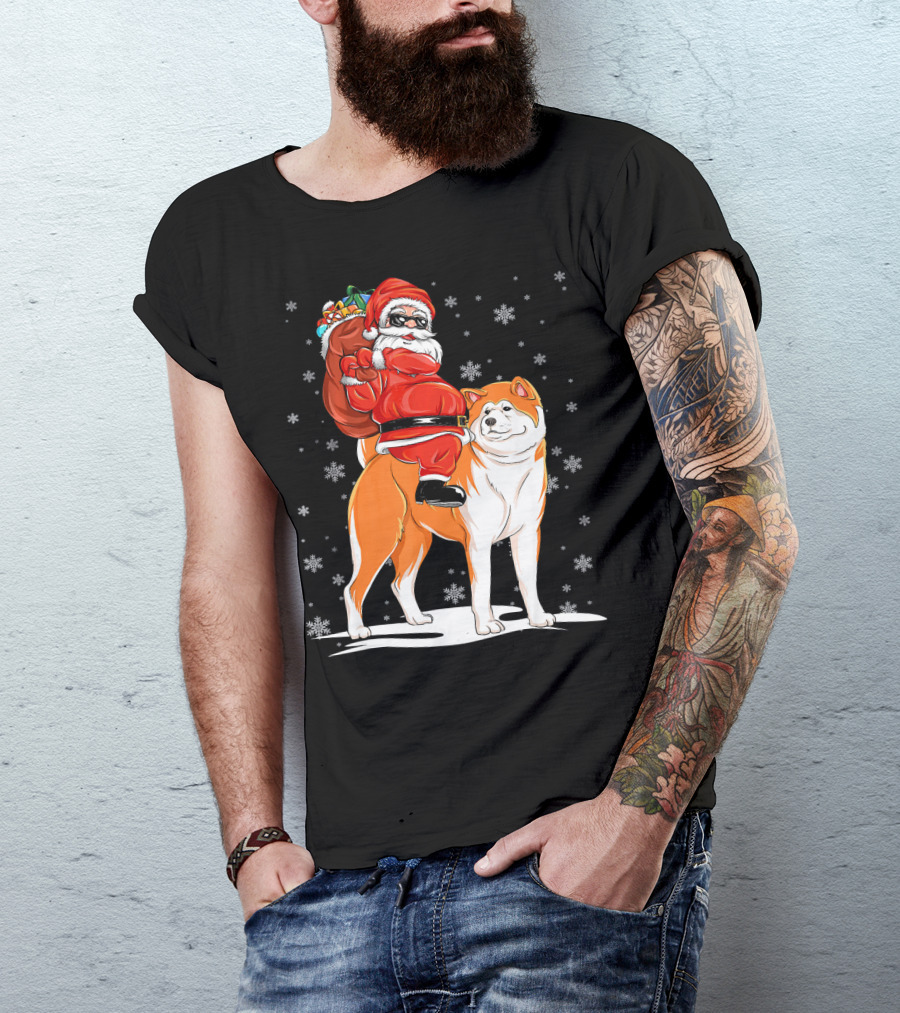 Santa Claus Riding Akita With Snowflakes And Gift Sack T-Shirt