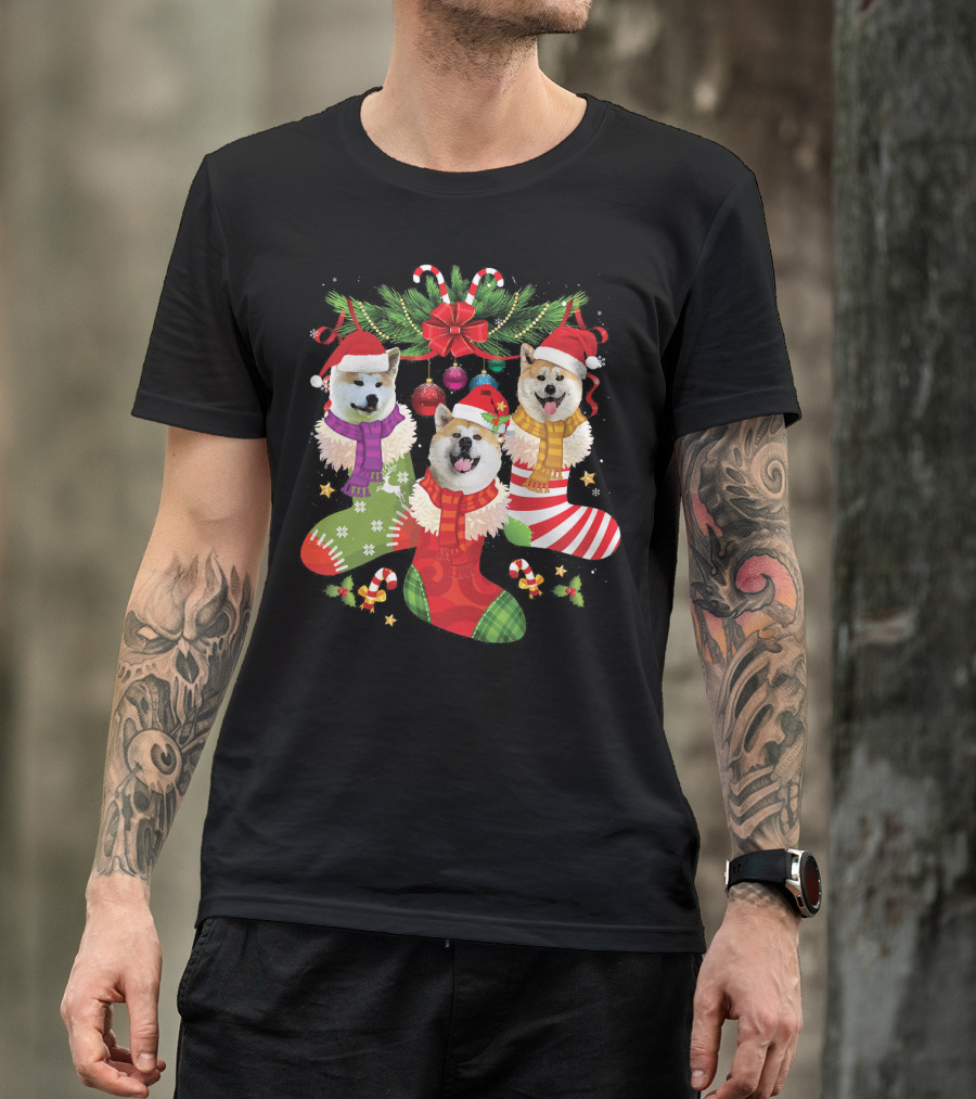 Three Akita Dog Puppies In Christmas Stockings With Santa Hats And Holiday Decorations T-Shirt
