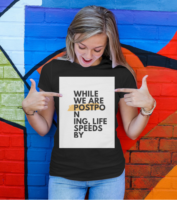While We Are Postponing Life Speeds By T-Shirt