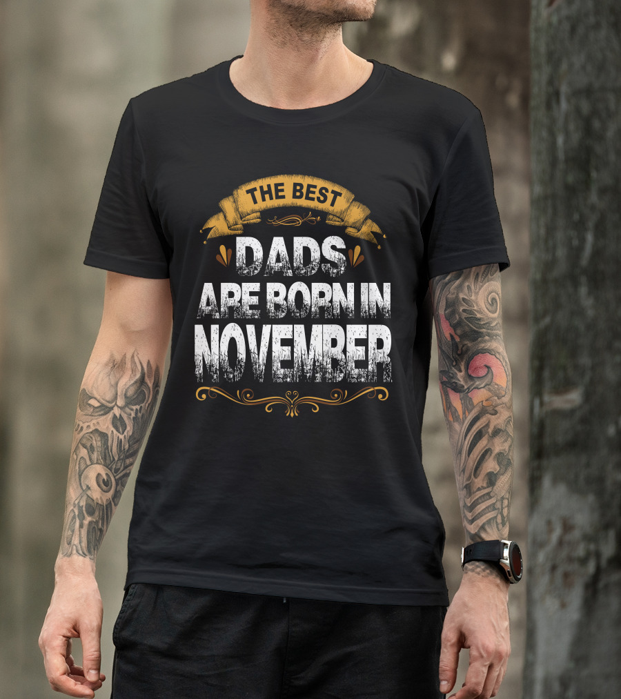 The Best Dads Are Born In November Text With Ornate Yellow Banner And Accents T-Shirt