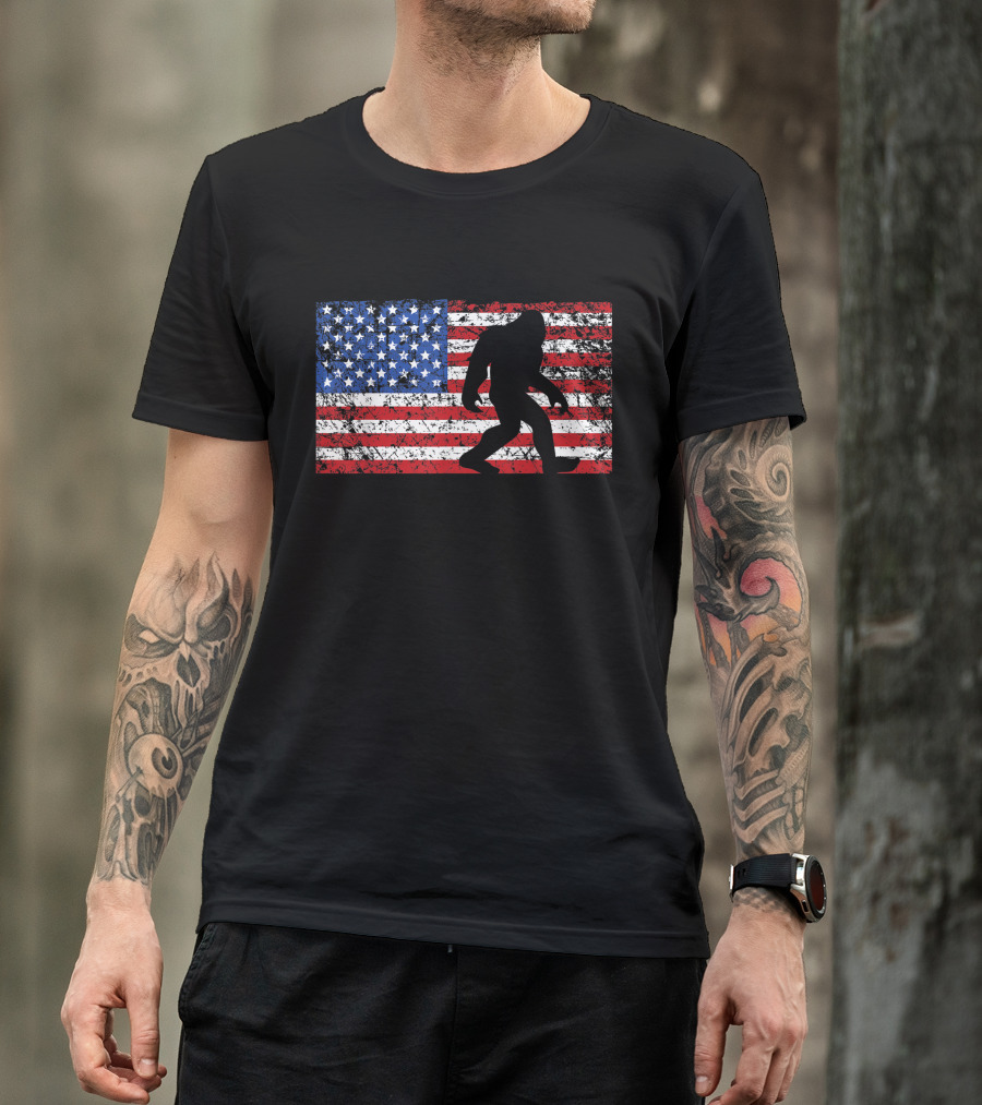 Bigfoot Silhouette On Distressed American Flag For Funny 4th Of July Sasquatch T-Shirt