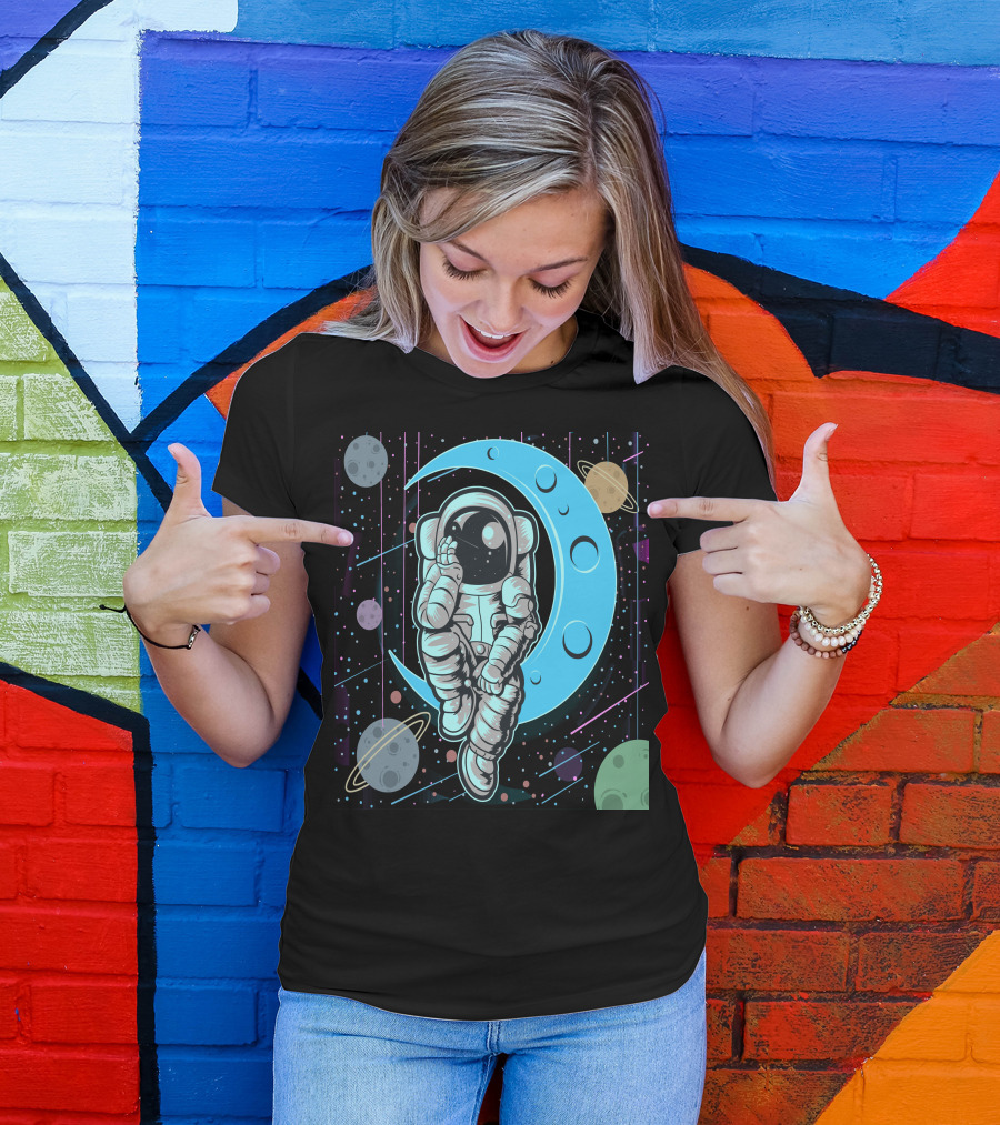 Thoughtful Astronaut On Crescent Moon With Colorful Planets T-Shirt