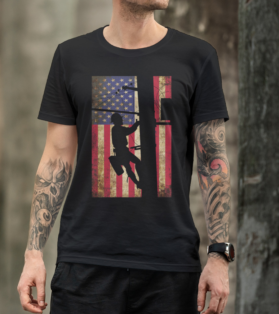 Lineman Climbing Electric Pole Against American Flag Background T-Shirt