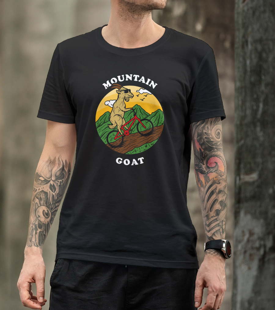 MOUNTAIN GOAT RIDING BIKE IN MOUNTAINS SUNSET T-Shirt