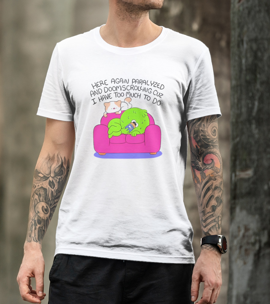 Here Again Paralyzed And Doomscrolling Cuz I Have Too Much To Do Quirky Green Figure Relaxing On Pink Couch With Cute Dog T-Shirt