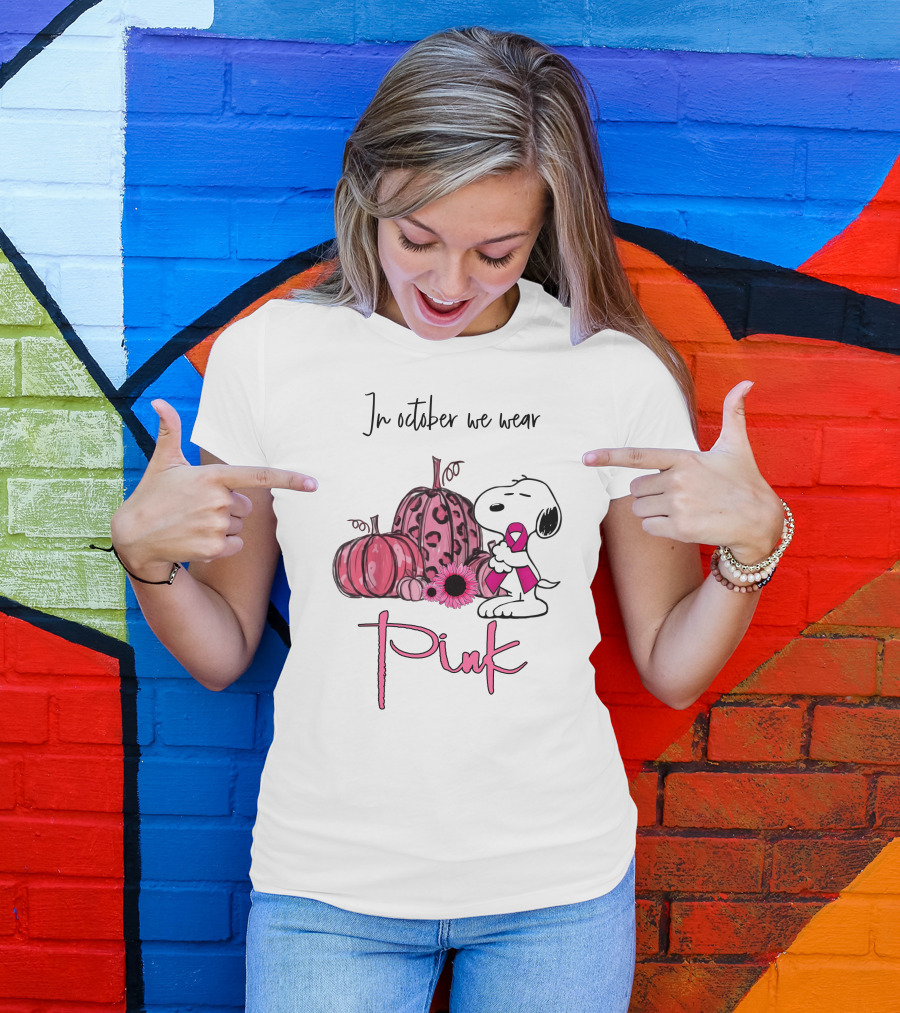 In October We Wear Pink With Peanuts Character Holding Ribbon And Pumpkins T-Shirt