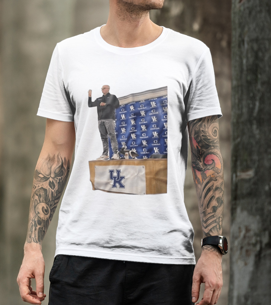 UK Volleyball Coach Craig Skinner Standing On Table With UK Logo And Awards T-Shirt