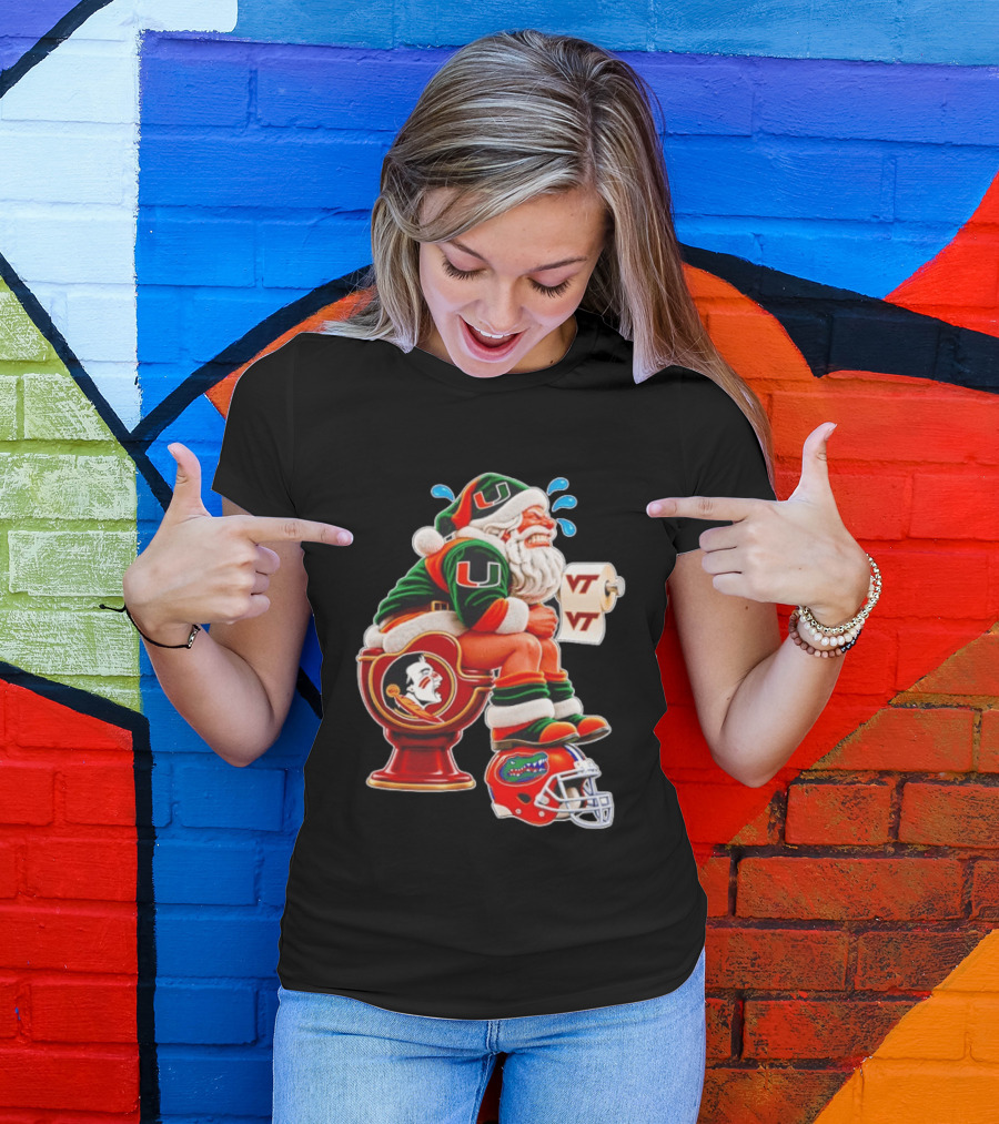 Miami Hurricanes Santa Claus Laughing On Florida State Toilet With Virginia Tech Toilet Paper And Florida Gators Helmet T-Shirt