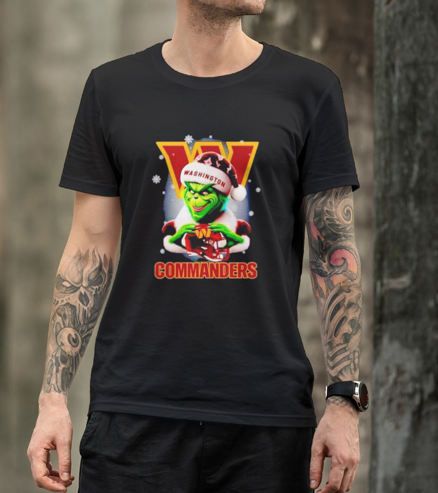 The Grinch Wearing Santa Hat Holding Gift For Washington Commanders Christmas T-Shirt