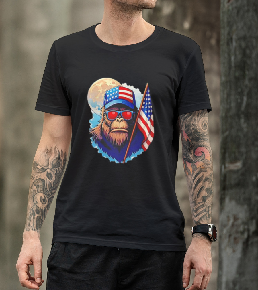 Bigfoot USA Flag Hat Sunglasses Patriotic Moon Background T-Shirt