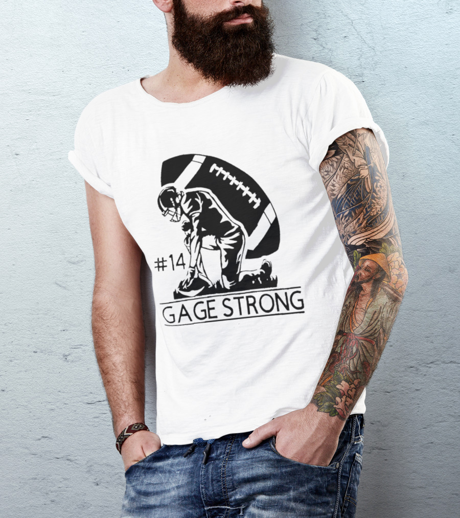 Gage Strong #14 Football Player Kneeling In Front Of Large Football T-Shirt