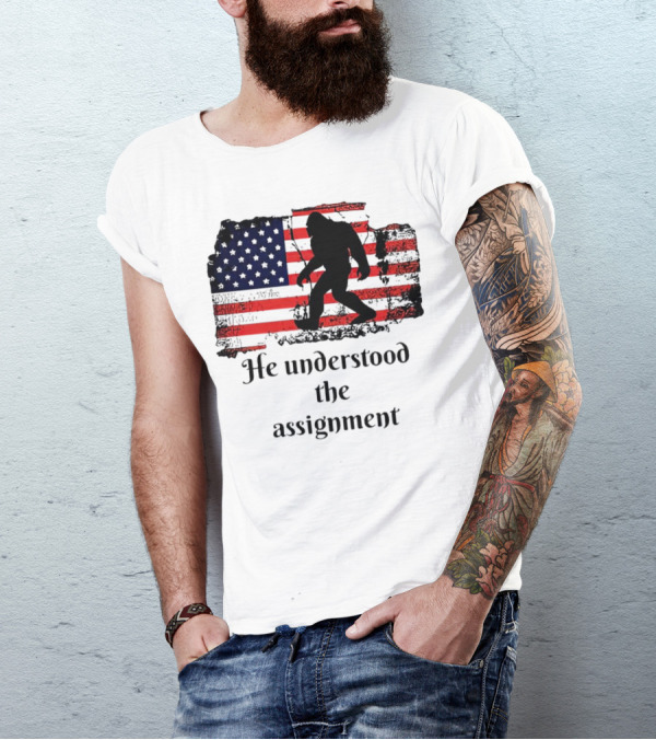 Bigfoot Silhouette With Distressed American Flag He Understood The Assignment T-Shirt