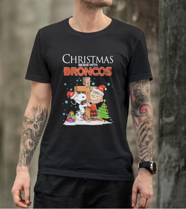 Christmas Begins With Broncos Charlie Brown Snoopy Hug Cross T-Shirt