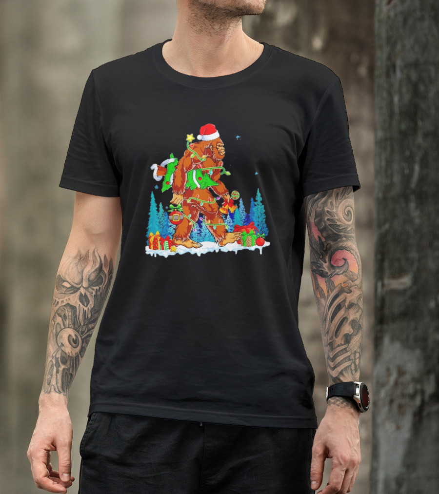 Bigfoot Santa Hugging Christmas Tree With Gifts And Snow Scene T-Shirt