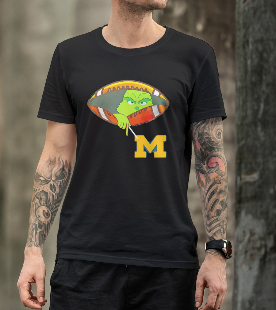 Grinch Peeking From Football Over Michigan Wolverines T-Shirt
