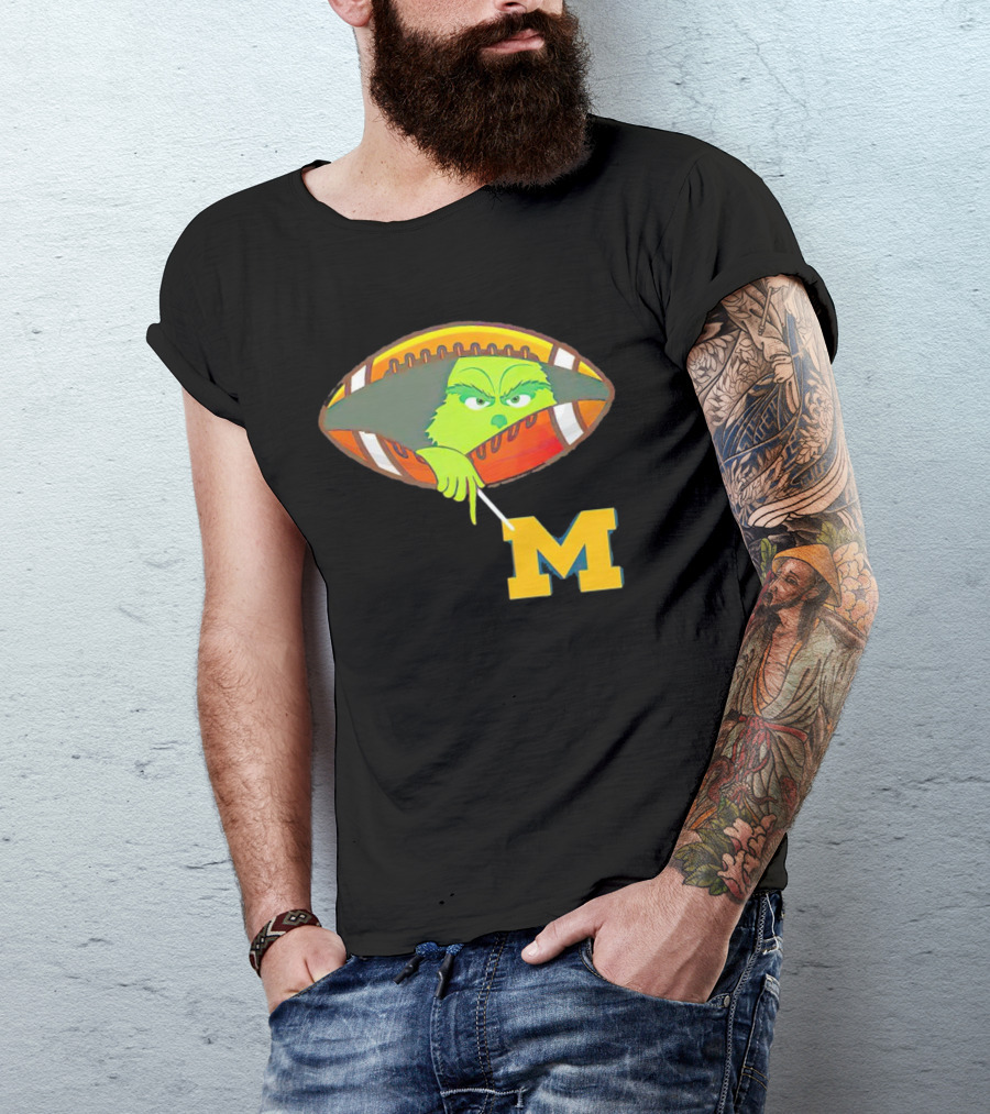 Grinch Peeking From Football Over Michigan Wolverines T-Shirt