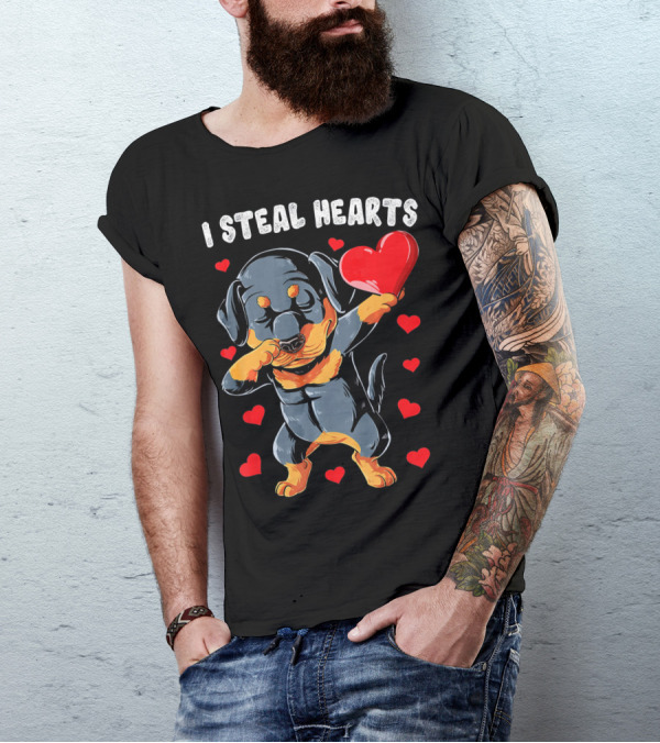 Dabbing Rottweiler Holding Heart Surrounded By I Steal Hearts Text T-Shirt