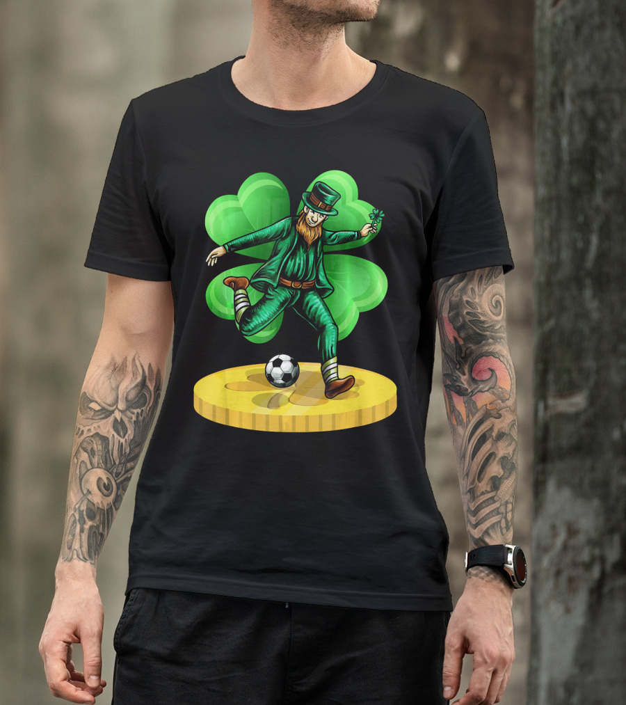 Leprechaun Kicking Soccer Ball On Gold Coin With Shamrock Background T-Shirt