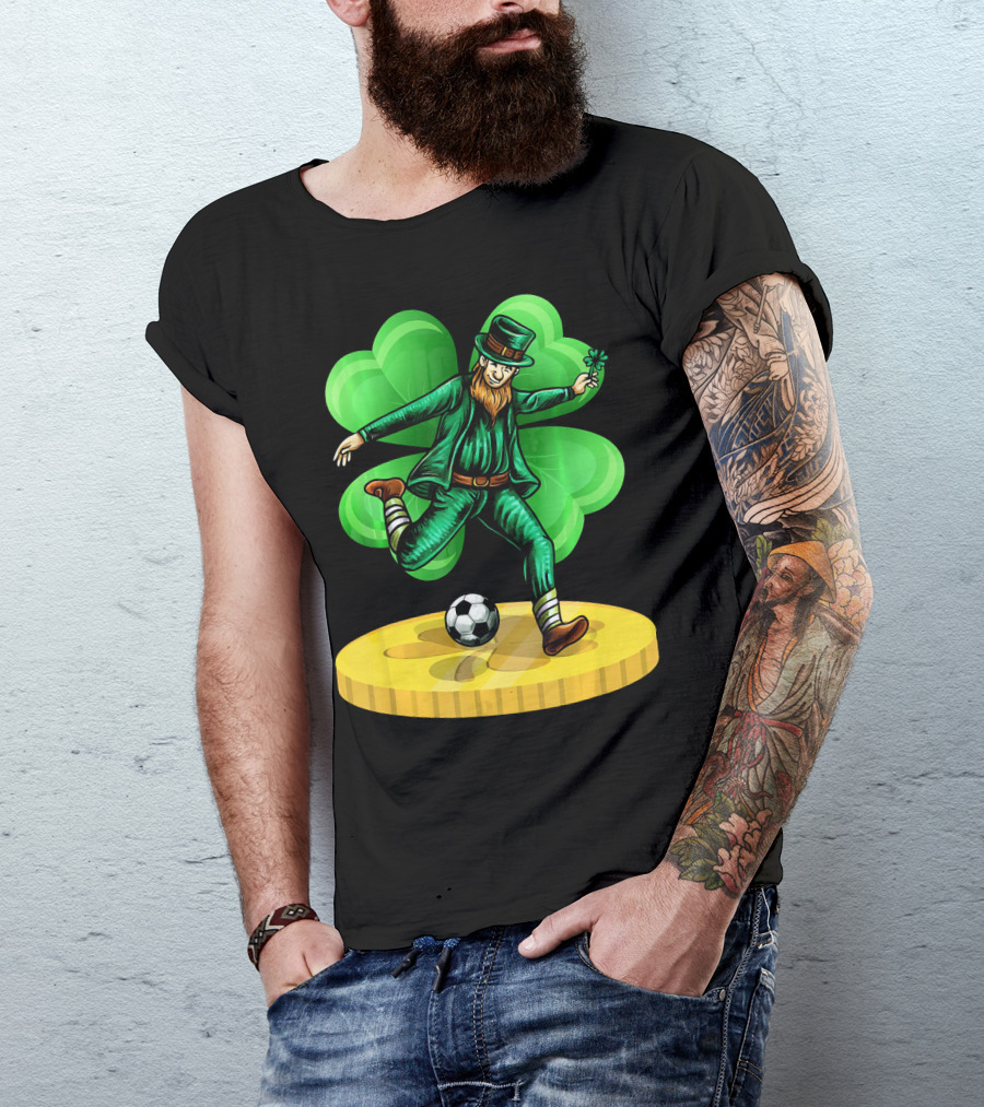 Leprechaun Kicking Soccer Ball On Gold Coin With Shamrock Background T-Shirt