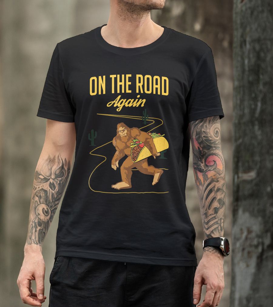 ON THE ROAD AGAIN Smirk Bigfoot Sasquatch Carrying Taco T-Shirt