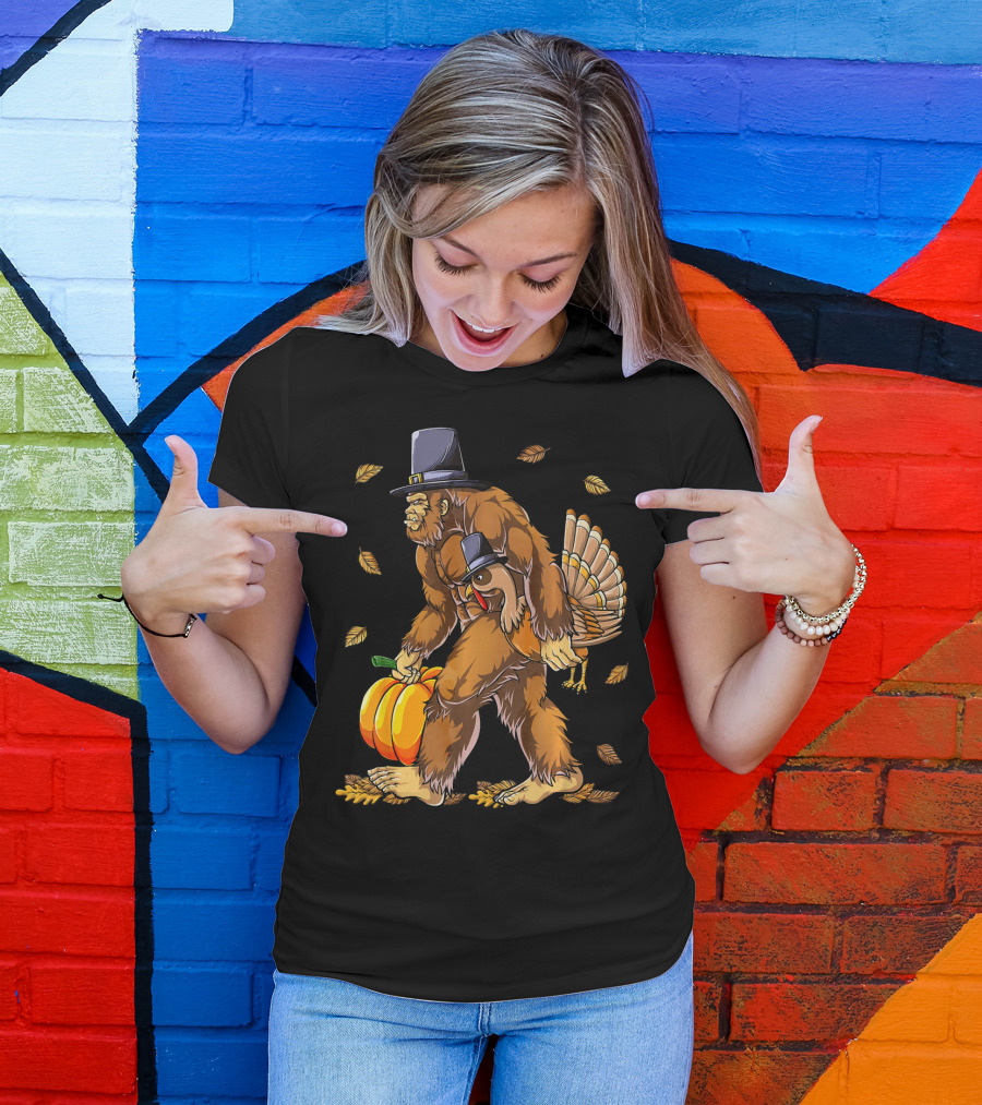Bigfoot Pilgrim Turkey Carrying Pumpkin Thanksgiving T-Shirt