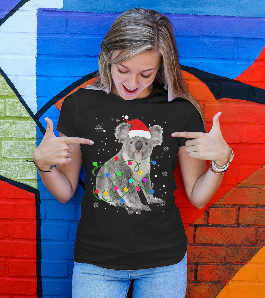 Koala Wrapped In Christmas Lights Wearing Santa Hat With Snowflakes Matching Fam T-Shirt
