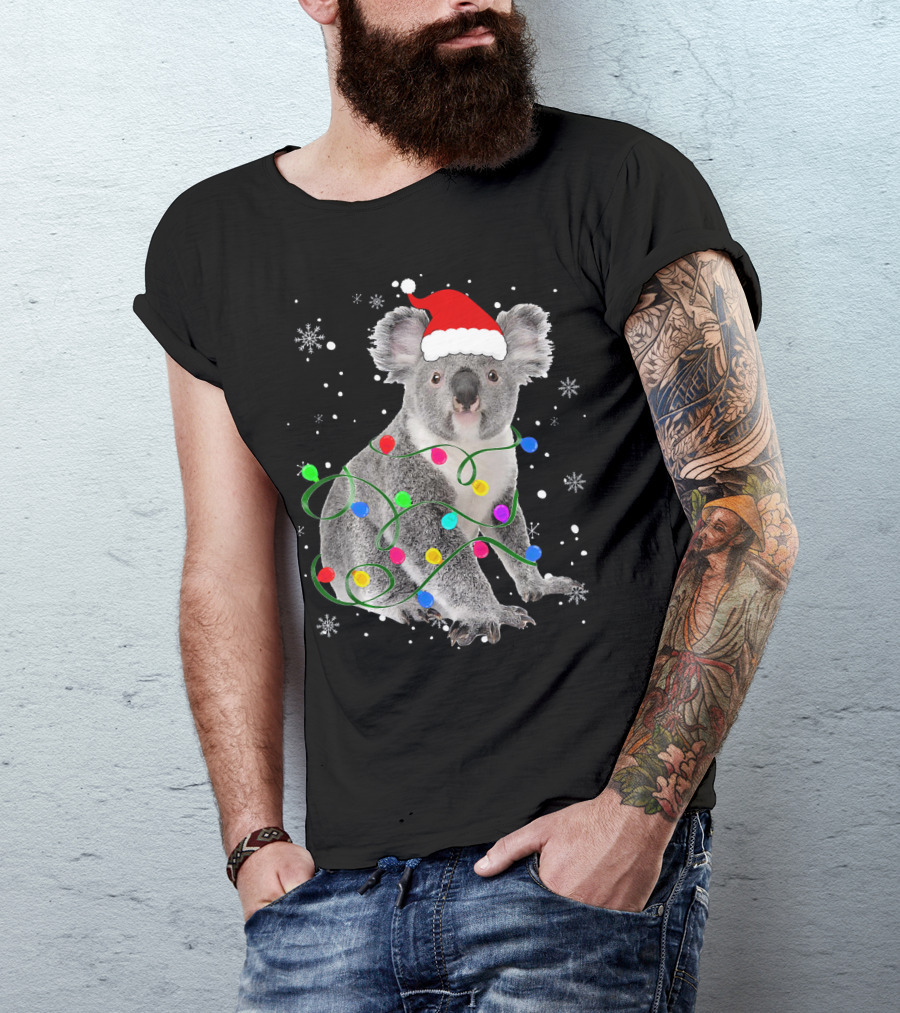 Koala Wrapped In Christmas Lights Wearing Santa Hat With Snowflakes Matching Fam T-Shirt