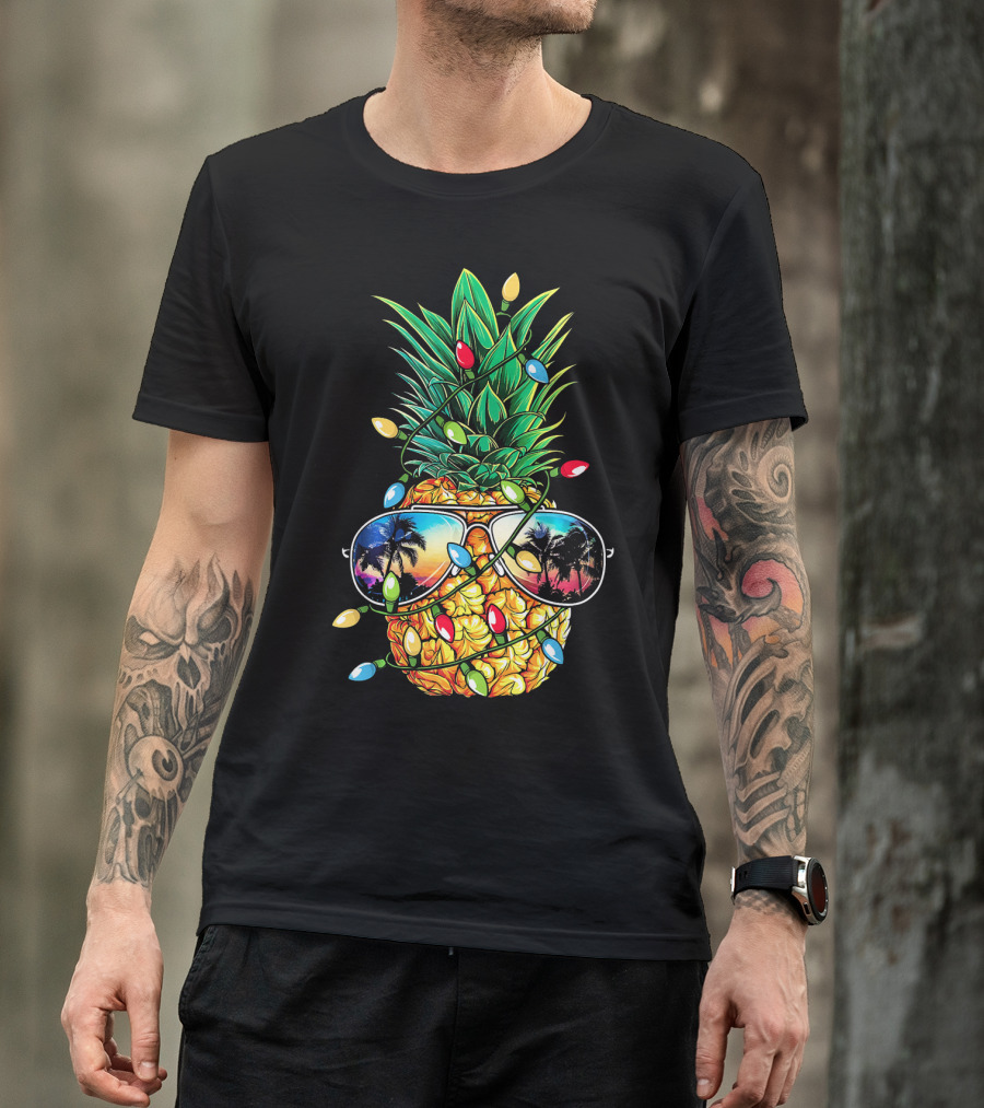 Pineapple Wrapped In Christmas Lights With Sunglasses Reflected Sunset And Palm Trees T-Shirt