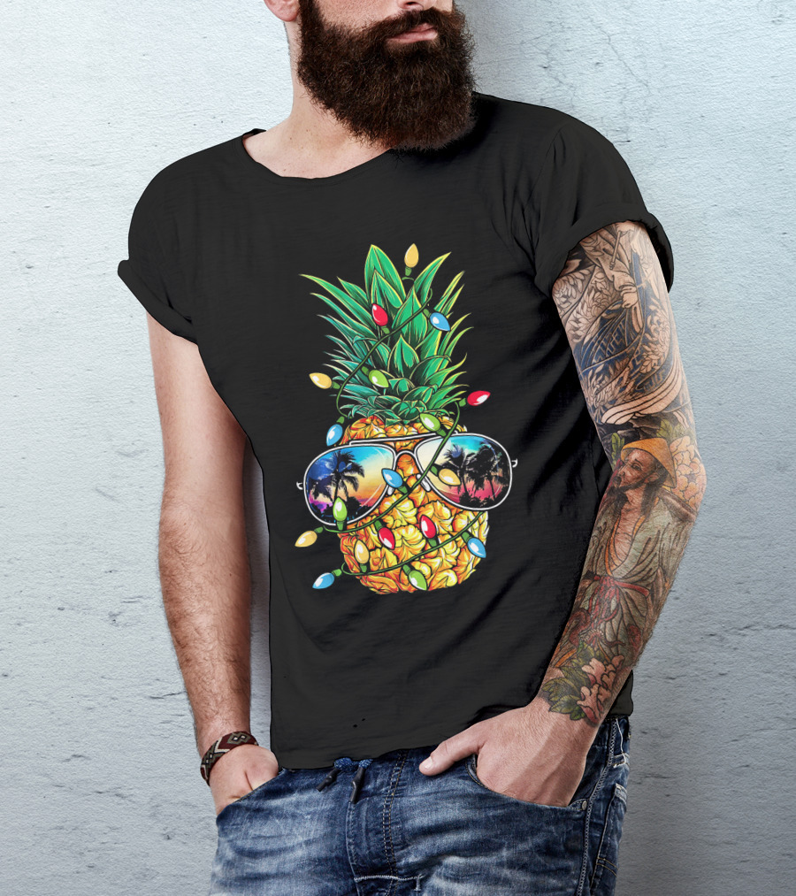Pineapple Wrapped In Christmas Lights With Sunglasses Reflected Sunset And Palm Trees T-Shirt