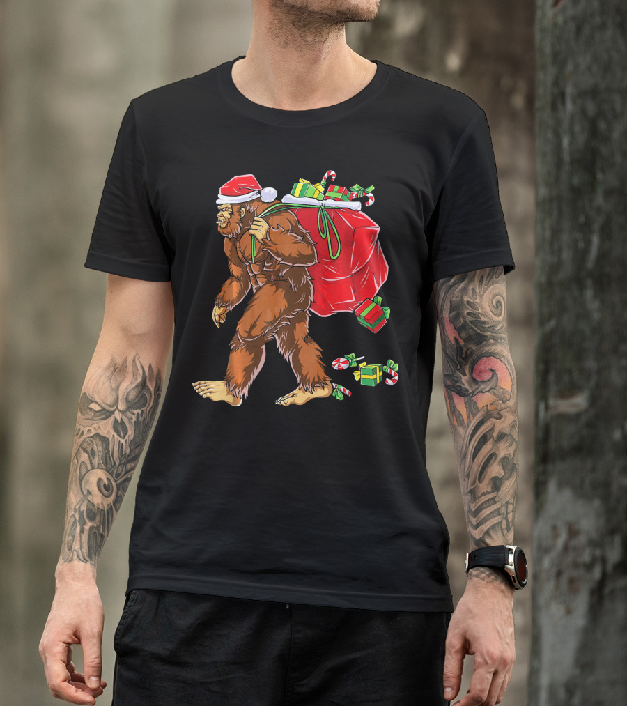 Bigfoot Santa Carrying Gifts With Candy Canes T-Shirt