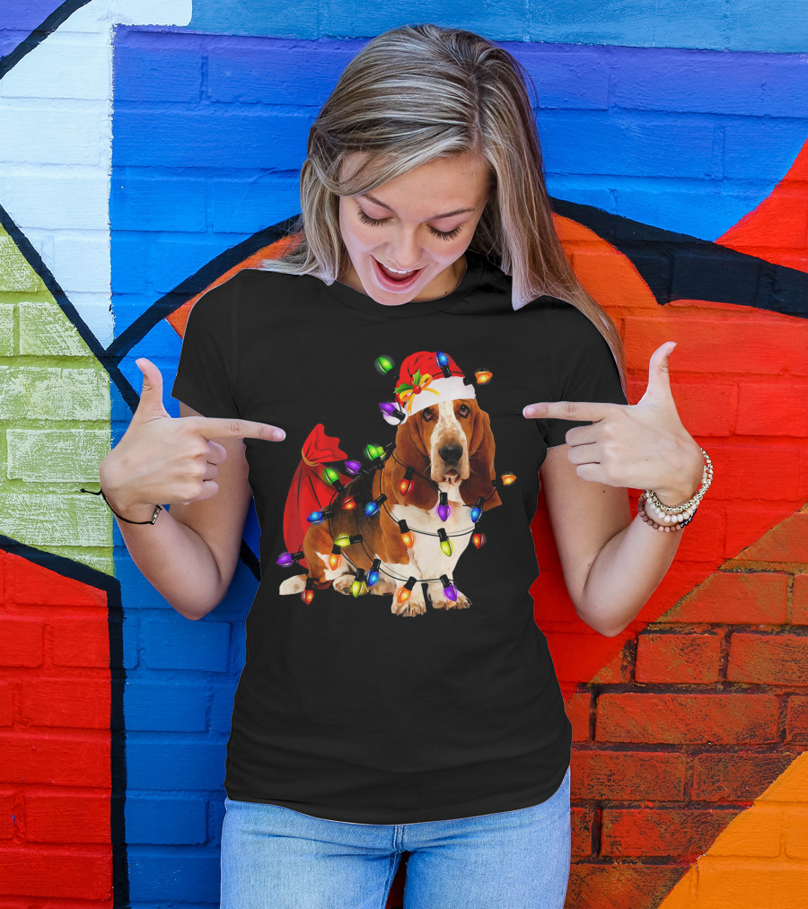 Basset Hound Wrapped In Christmas Lights With Santa Hat And Red Sack T-Shirt