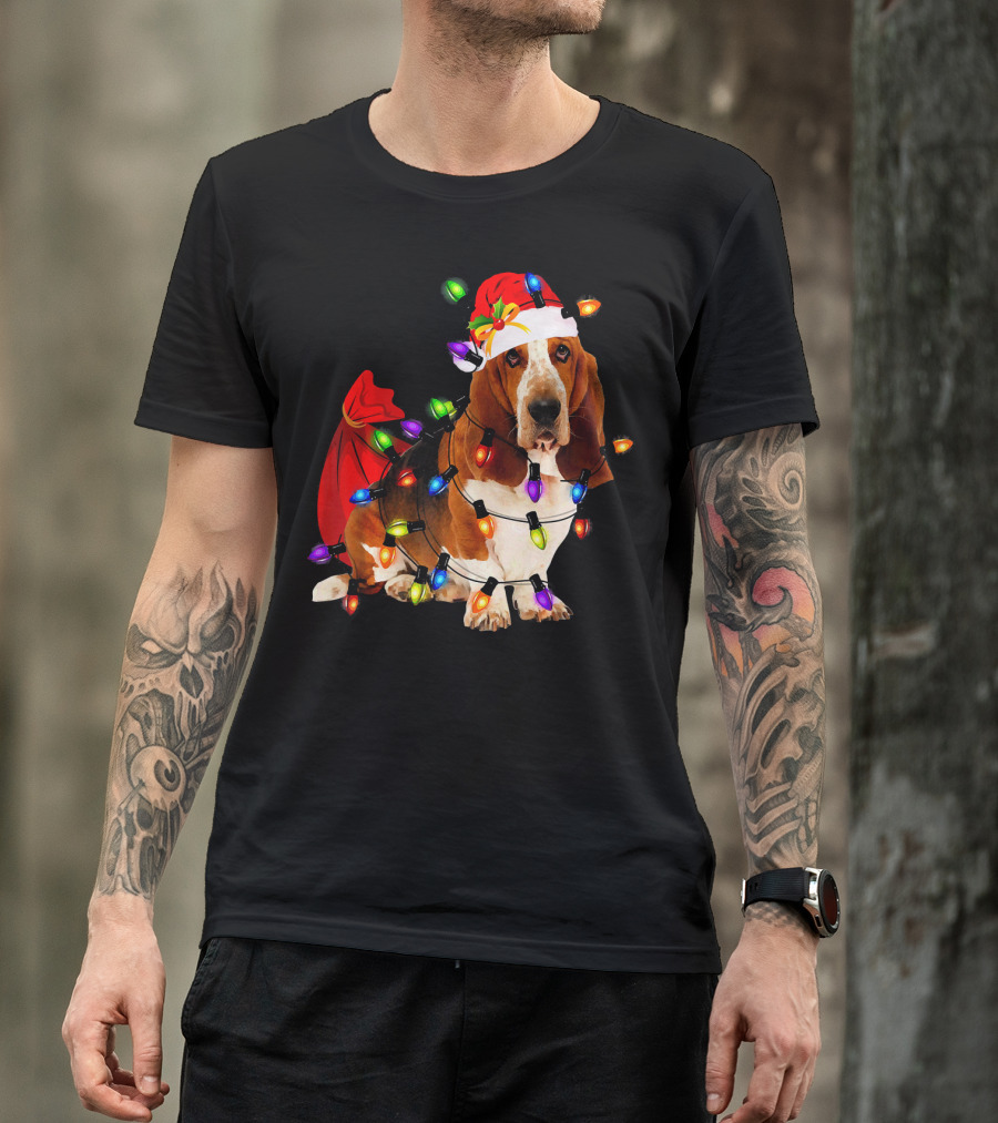 Basset Hound Wrapped In Christmas Lights With Santa Hat And Red Sack T-Shirt
