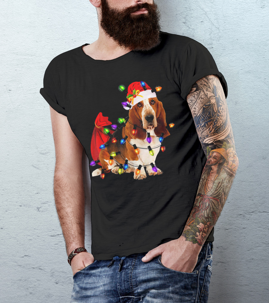 Basset Hound Wrapped In Christmas Lights With Santa Hat And Red Sack T-Shirt
