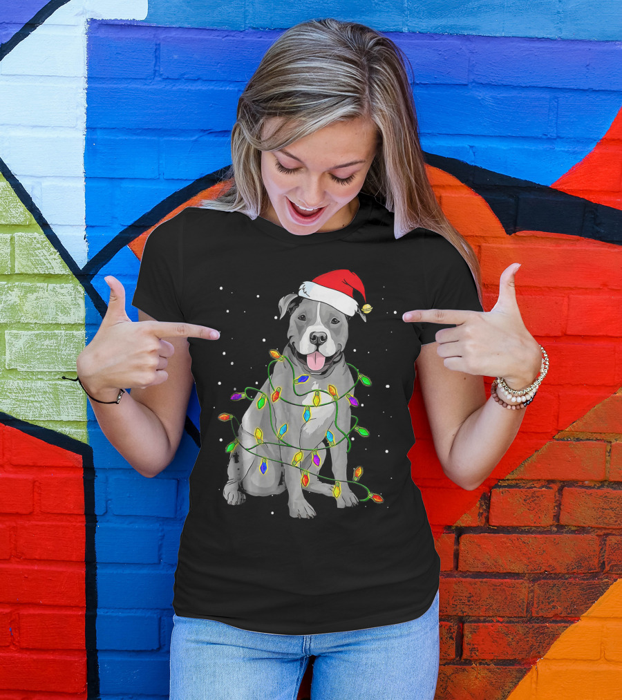 Pitbull In Santa Hat Wrapped In Christmas Lights With Snowy Background T-Shirt