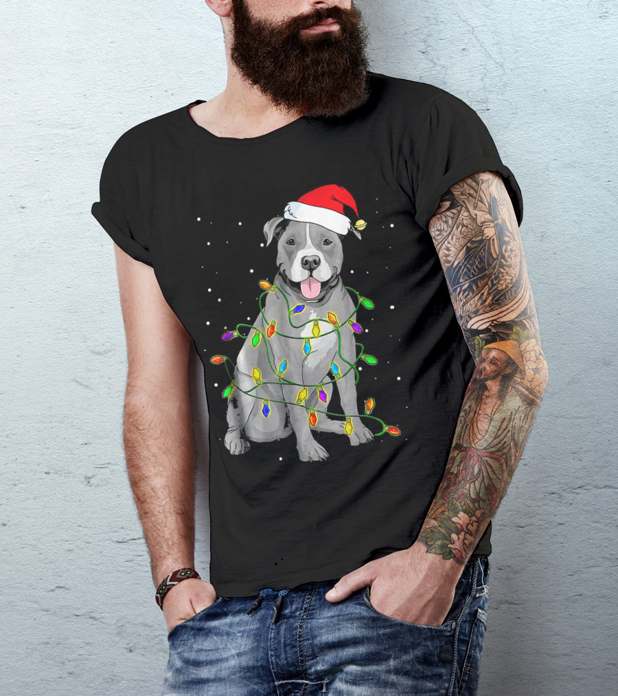 Pitbull In Santa Hat Wrapped In Christmas Lights With Snowy Background T-Shirt