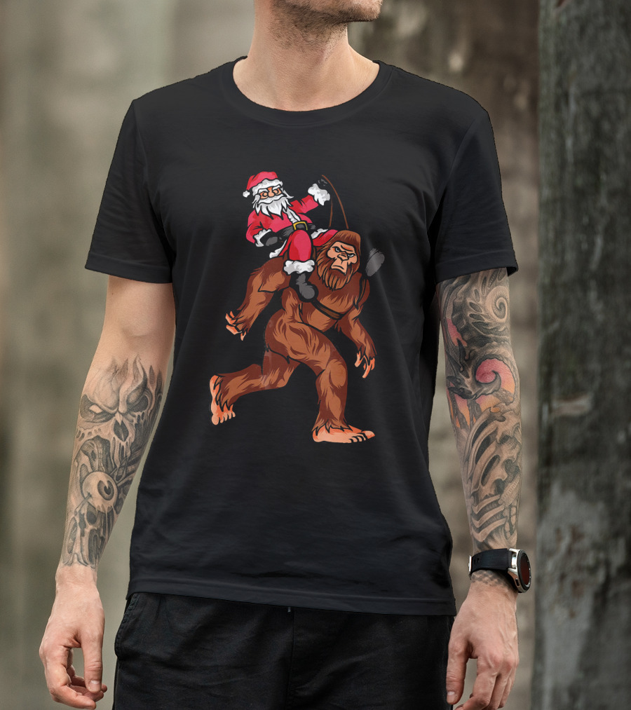 Bigfoot Carrying Santa Claus In Christmas T-Shirt